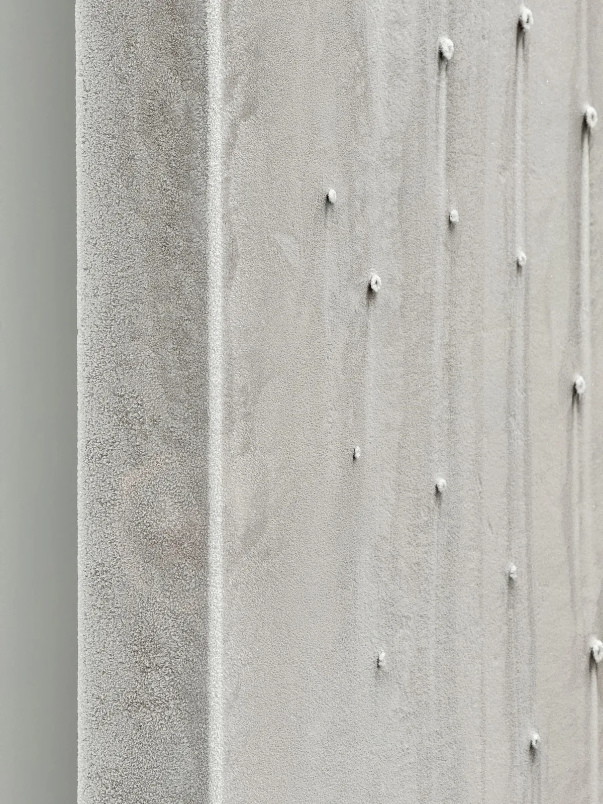 Close-up of a rough plaster surface, cropped past recognition